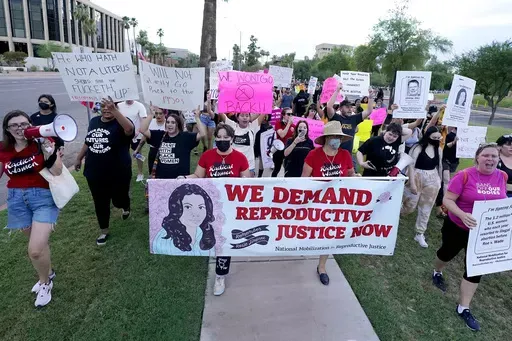 Thousands of protesters march around the Arizona Capitol in protest after the Supreme Court decision to overturn the landmark Roe v. Wade abortion decision Friday, June 24, 2022, in Phoenix. An Arizona Supreme Court ruling, Tuesday, April 9, 2024, allowing enforcement of an abortion ban is the latest action to elevate abortion as a key political issue this year. (AP Photo/Ross D. Franklin, File)