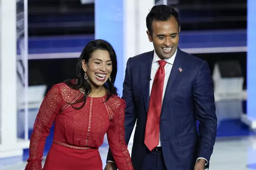 Republican presidential candidate businessman Vivek Ramaswamy and his wife Apoorva walks on stage after a Republican presidential primary debate hosted by NBC News, Nov. 8, 2023, at the Adrienne Arsht Center for the Performing Arts of Miami-Dade County in Miami. Ramaswamy's presidential campaign has seemingly mirrored his meteoric rise as a biotech entrepreneur. The political novice from Ohio has taken the route of a self-described outsider.(AP Photo/Rebecca Blackwell, File)