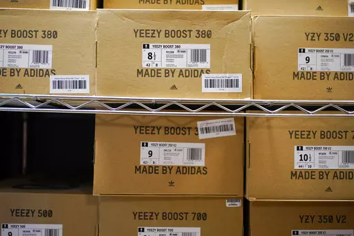 Boxes containing Yeezy shoes made by Adidas are seen at Laced Up, a sneaker resale store, in Paramus, N.J., Tuesday, Oct. 25, 2022. Adidas’ breakup with rapper Kanye West and the inability to sell his popular Yeezy line of shoes helped batter the company’s earnings at the end of last year. The German shoe and sportswear maker said Wednesday, March 8, 2023, that higher supply costs and slumping revenue in China also helped lead to a net loss of 513 million euros or $540 million in the fourth 
