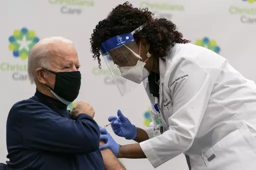 President-elect Joe Biden receives his first dose of the coronavirus vaccine from Nurse partitioner Tabe Mase at Christiana Hospital in Newark Del., on Dec. 21, 2020, from nurse practitioner. Biden’s order that federal employees get vaccinated against COVID-19 was blocked Thursday, March 23, 2023, by a federal appeals court. (AP Photo/Carolyn Kaster, File)