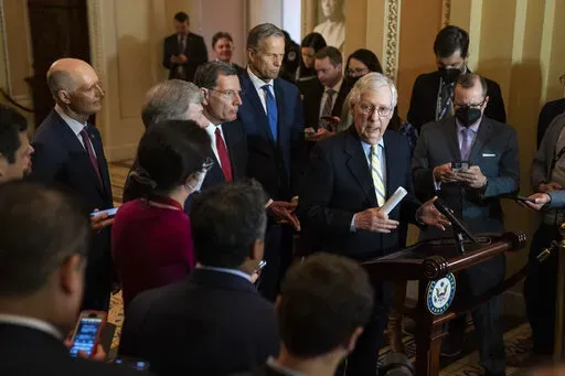 Senate Minority Leader Mitch McConnell of Ky., talks with reporters after a policy luncheon, Tuesday, April 5, 2022, at the Capitol in Washington. (AP Photo/Evan Vucci)