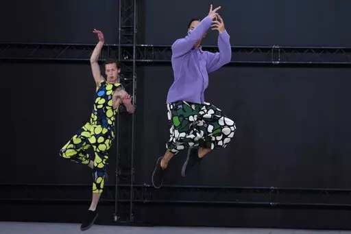 Models wear creations as part of Issey Miyake Homme Plisse men's Spring Summer 2023 collection presented in Paris, France, Thursday, June 23, 2022. (AP Photo/Francois Mori)