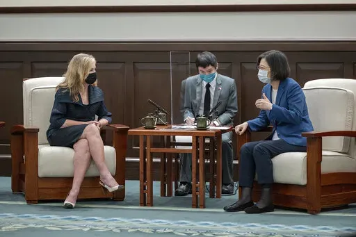 In this photo released by the Taiwan Presidential Office, U.S. Sen. Marsha Blackburn meets with Taiwan's President Tsai Ing-wen in Taipei, Taiwan on Friday, Aug. 26, 2022. Blackburn met with Tsai on Friday, in the second visit by members of Congress since House Speaker Nancy Pelosi's trip earlier this month sharply raised tensions with China. (Taiwan Presidential Office via AP)