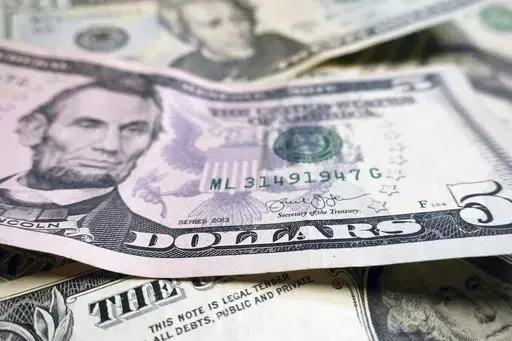FILE- This Wednesday, June 6, 2018, file photo shows U.S. currently in New York.  Receiving a financial windfall is exciting. Your emotions soar with the possibilities: a new car, a vacation, or perhaps paying off debt. It’s your money personality that drives your response to sudden cash.  (AP Photo/Ted Shaffrey, File)