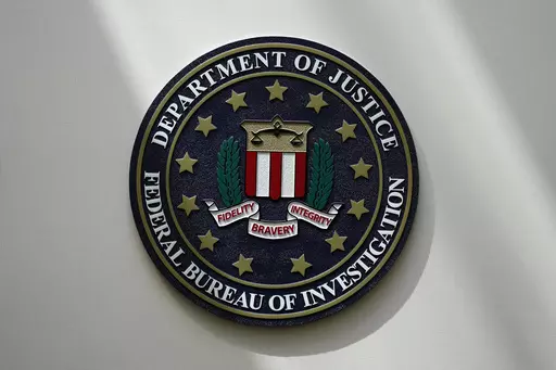 The FBI seal is pictured in Omaha, Neb., Aug. 10, 2022. FBI officials repeatedly violated their own standards when they searched a vast repository of foreign intelligence for information related to the insurrection at the U.S. Capitol on Jan. 6, 2021, and racial justice protests in 2020. That's according to a heavily blacked-out court order released Friday, May 19, 2023. FBI officials said the violations predated a series of corrective measures that started in the summer of 2021 and continued la