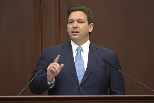 Florida Gov. Ron DeSantis addresses a joint session of a legislative session, Jan. 11, 2022, in Tallahassee, Fla. Florida Gov. DeSantis on Tuesday, April 19, asked the Legislature to repeal a law allowing Walt Disney World to operate a private government over its properties in the state, the latest salvo in a feud between the Republican and the media giant. (AP Photo/Phelan M. Ebenhack, File)