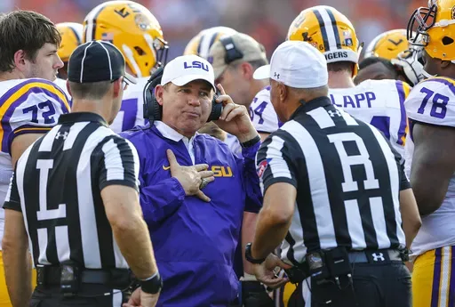 Then-LSU head coach Les Miles talks with referees during the first half of an NCAA college football game against Auburn in Auburn, Ala., Sept. 24, 2016. (AP Photo/Butch Dill, File)
