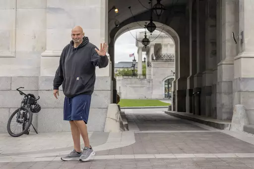 Sen. John Fetterman, D-Penn., waves to members of the media, Monday, April 17, 2023, on Capitol Hill in Washington, as he returns to the Capitol after seeking inpatient treatment for clinical depression. (AP Photo/Jacquelyn Martin, File)