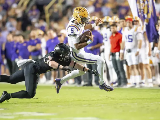 LSU quarterback Jayden Daniels (5) runs the ball against Army during an NCAA college football game in Baton Rouge, La., Saturday, Oct. 21, 2023. (Scott Clause/The Daily Advertiser via AP)