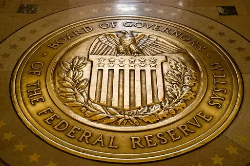 FILE- In this Feb. 5, 2018, file photo, the seal of the Board of Governors of the United States Federal Reserve System is displayed in the ground at the Marriner S. Eccles Federal Reserve Board Building in Washington.Richmond Federal Reserve President Thomas Barkin on Friday, Feb. 17, 2023 downplayed recent signs that the economy is strengthening, but also said he is prepared to keep raising interest rates in smaller increments as often as needed to quell inflation. (AP Photo/Andrew Harnik, File