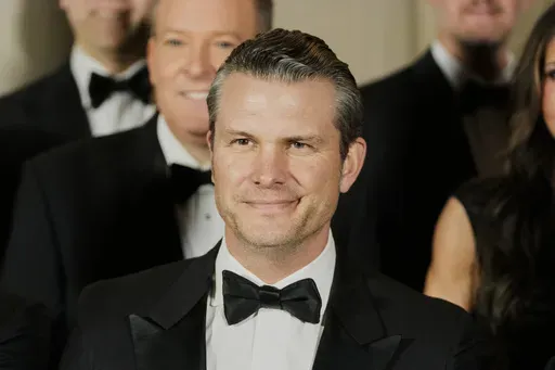 Pete Hegseth, President-elect Donald Trump's choice to be Defense Secretary, poses for a photo with Cabinet picks, other nominees and appointments, at the National Gallery of Art in Washington, Saturday, Jan. 18, 2025. (AP Photo/Mark Schiefelbein)