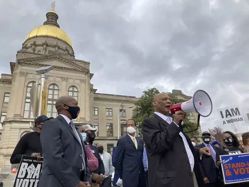 African Methodist Episcopal Church Bishop Reginald Jackson announces a boycott of Coca-Cola Co. products outside the Georgia Capitol on March 25, 2021 in Atlanta. The Supreme Court decision ordering Alabama to redraw its congressional maps is a surprise victory for Black and Latino voters across the country who say legislatures in a number of Republican-controlled states have drawn districts in a way that dilutes their political strength. (AP Photo/Jeff Amy, File)