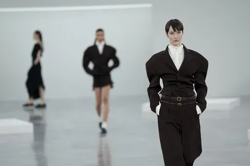 A model wears a creation as part of the Issey Miyake Fall/Winter 2025-2026 Womenswear collection presented in Paris, Friday, March 7, 2025. (Photo by Scott A Garfitt/Invision/AP)