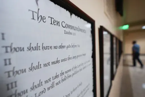 A copy of the Ten Commandments is posted along with other historical documents in a hallway of the Georgia Capitol, Thursday, June 20, 2024, in Atlanta. Christians and Jews believe in the Ten Commandments — just not necessarily the version that will hang in every public school and state-funded college classroom in Louisiana. (AP Photo/John Bazemore, File)