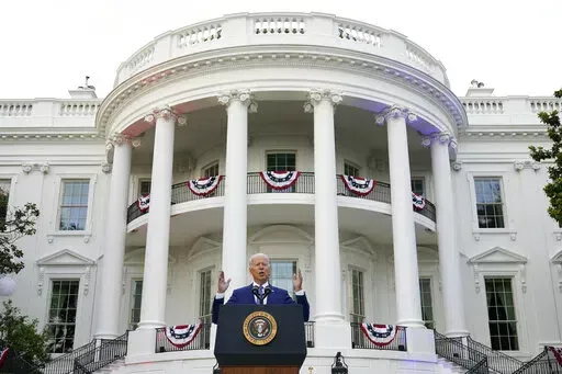 President Joe Biden speaks during an Independence Day celebration on the South Lawn of the White House, July 4, 2021, in Washington. Last Fourth of July, Biden gathered hundreds of people outside the White House for an event that would have been unthinkable for many Americans the previous year. With the coronavirus in retreat, they ate hamburgers and watched fireworks over the National Mall. (AP Photo/Patrick Semansky, File)