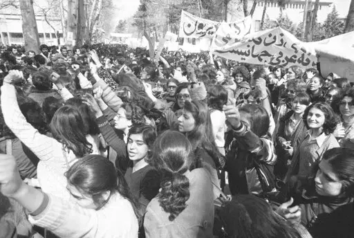 Iranian women demonstrate for equal rights, March 12, 1979. Iran's Islamic Republic requires women to cover up in public. But many Iranian women have long played a game of cat-and-mouse with authorities as a younger generation wears their veils more loosely or skirts requirements for conservative dress. (AP Photo/Richard Tomkins, File)