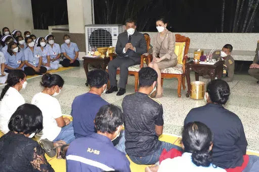 Thailand's King Maha Vajiralongkorn, left, and his wife Queen Suthida visit the Nongbua Lamphu hospital to meet with relatives of the victims of the day care center attack in the rural town of Uthai Sawan, north eastern Thailand, Friday, Oct. 7, 2022. A former police officer burst into a day care center in northeastern Thailand on Thursday, killing dozens of preschoolers and teachers before shooting more people as he fled. (Matichol Newspaper via AP)