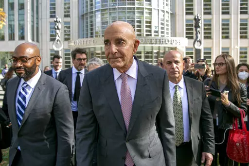 Tom Barrack, center, leaves Brooklyn Federal Court, Friday, Nov. 4, 2022, in New York. Barrak, former President Donald Trump's inaugural committee chair, was acquitted of all counts Friday at a federal trial in which he was accused of using his personal access to the former president to secretly promote the interests of the United Arab Emirates.  (AP Photo/Ted Shaffrey)