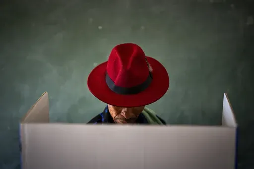 A voter fills out a ballot paper during general elections in Nkandla, Kwazulu Natal, South Africa, on May 29, 2024. (AP Photo/Emilio Morenatti, file)