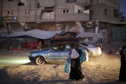 Palestinians displaced by the Israeli air and ground offensive on the Gaza Strip flee from parts of Khan Younis following an evacuation order by the Israeli army to leave the eastern part of Gaza Strip's second largest city on Monday, July 1, 2024. (AP Photo/Jehad Alshrafi)