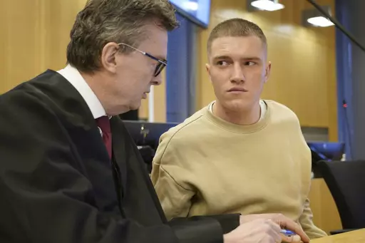 Former member of the Russian private military contractor Wagner Group Andrey Medvedev, right, listens to his lawyer Brynjulf Risnes during a court hearing in Oslo, Tuesday, April 25, 2023. Medvedev, who is seeking asylum in Norway, was Tuesday facing a Norwegian court for a bar brawl earlier this year. Medvedev has confessed to most of the charges for events in February and March but denies violence against police officers who handcuffed him outside an Oslo pub, the Norwegian news agency NTB sai
