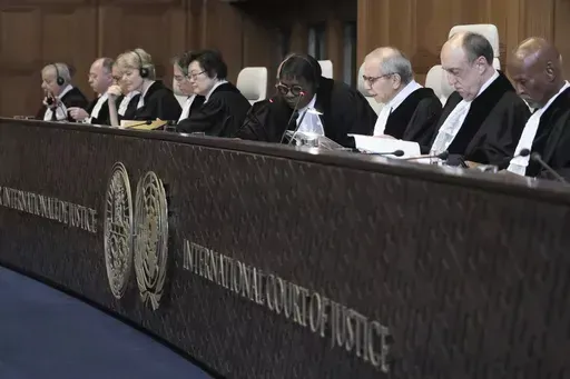 Judge Nawaf Salam, third right, speaks at the start of a two days hearing at the World Court in The Hague, Netherlands, Monday, April 8, 2024, in a case brought by Nicaragua accusing Germany of breaching the genocide convention by providing arms and support to Israel. (AP Photo/Patrick Post)