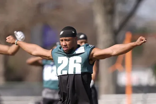 Philadelphia Eagles running back Saquon Barkley (26) warms up during an NFL football practice Wednesday, Feb. 5, 2025, in New Orleans, ahead of Super Bowl 59 against the Kansas City Chiefs. (AP Photo/Gerald Herbert)