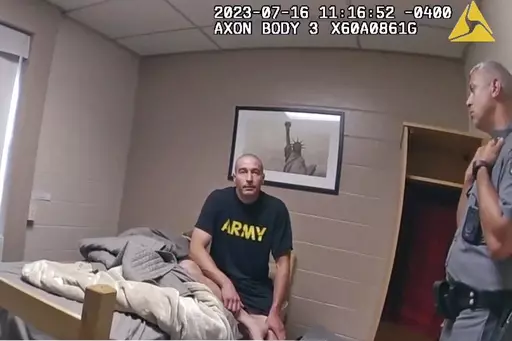 In this image taken from New York State Police body camera video that was obtained by WMTW-TV 8 in Portland, Maine, New York State police interview Army Reservist Robert Card, the man responsible for Maine's deadliest mass shooting, at Camp Smith in Cortlandt, New York on July 16, 2023. Card told state police before being hospitalized that fellow soldiers were worried about him because he was ”gonna friggin' do something,” according to police body cam video released under New York's Freedom 
