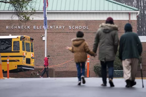 Students return to Richneck Elementary in Newport News, Va., on Jan. 30, 2023. The mother a 6-year-old who shot his teacher in Virginia is expected to plead guilty Tuesday, Aug. 15, 2023, seven months after her son used her handgun in the classroom shooting. (Billy Schuerman/The Virginian-Pilot via AP)