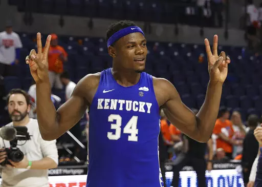 Kentucky forward Oscar Tshiebwe (34) celebrates after an NCAA college basketball game against Florida, Saturday, March 5, 2022, in Gainesville, Fla. (AP Photo/Matt Stamey)