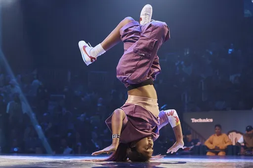 Logan Edra, also known as B-Girl Logistx, of the United States competes in the B-girl Red Bull BC One World Final at Hammerstein Ballroom on Saturday, Nov. 12, 2022, in New York. (AP Photo/Andres Kudacki, File)