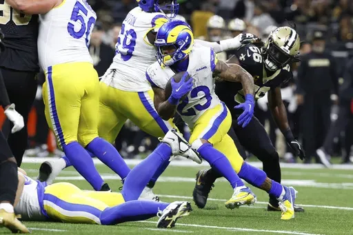 Los Angeles Rams running back Kyren Williams (23) runs for a touchdown during the second half of an NFL football game against the New Orleans Saints, Sunday, Dec. 1, 2024, in New Orleans. (AP Photo/Butch Dill)