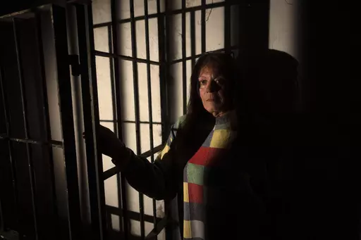 Julieta Gonzalez poses for a photo inside the Banfield Pit, where the Argentine military dictatorship held her for a month, in Buenos Aires, Argentina, Tuesday, May 23, 2023. Gonzalez and four other trans women testified in April about the repression they suffered, part of what human rights lawyers and activists say is a long overdue effort to recognize systematic human rights violations suffered by members of the trans community under the country’s military rule. (AP Photo/Victor R. Caivano)