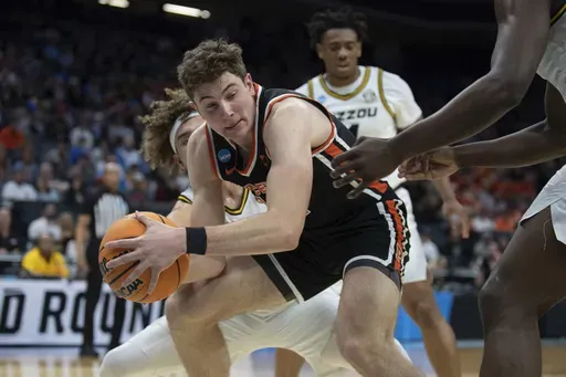 Princeton forward Caden Pierce (12) looks to pass the ball while surrounded by Missouri defenders during the first half of a second-round college basketball game in the men's NCAA Tournament, March 18, 2023, in Sacramento, Calif. (AP Photo/José Luis Villegas, file)