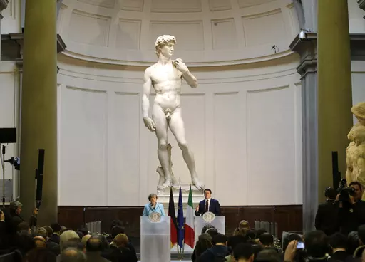 German Chancellor Angela Merkel, left, and Italian Prime Minister Matteo Renzi speak during a press conference in front of Michelangelo's "David statue" after their bilateral summit in Florence, Italy, Jan. 23, 2015. A Florida charter school principal has been forced to resign after a parent complained sixth graders were exposed to pornography during a lesson on Renaissance art that included Michelangelo’s “David” sculpture. (AP Photo/Antonio Calanni, File)