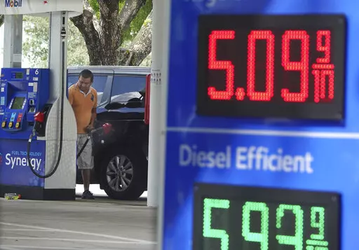 For the first time ever, the price for a gallon of regular gas in Broward County is selling at some gas stations for more than five dollars, as seen at this Mobil station in Margate, Fla., on Sunday, June, 12, 2022. (Joe Cavaretta/South Florida Sun-Sentinel via AP)