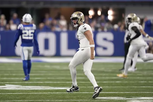 New Orleans Saints quarterback Derek Carr (4) celebrates a first down against the Indianapolis Colts during the second half of an NFL football game Sunday, Oct. 29, 2023 in Indianapolis. (AP Photo/Michael Conroy)