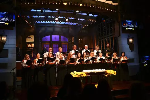 This photo provided by NBC shows Ukrainian Chorus Dumka of New York performing "Prayer for Ukraine" during the opening of “Saturday Night Live” on Saturday, Feb. 26, 2022. (Will Heath/NBC via AP)