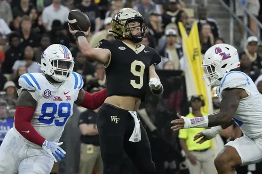 Wake Forest quarterback Hank Bachmeier (9) looks to pass as Mississippi defensive tackle JJ Pegues (89) closes in during the first half of an NCAA college football game in Winston-Salem, N.C., Saturday, Sept. 14, 2024. (AP Photo/Chuck Burton)