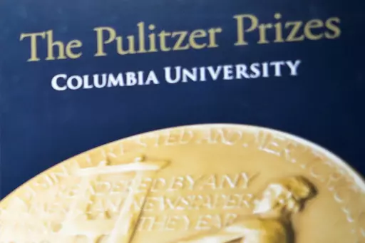 A sign for the Pulitzer Prize is shown at Columbia University, Tuesday May 28, 2019, in New York. The Pulitzer Prizes will be awarded Monday, May 8, 2023 and honor outstanding journalism during a violent year that included Russia’s brutal invasion of Ukraine, mass shootings that targeted an elementary school and supermarket and communities beset with climate change-fueled flood and flames. (AP Photo/Bebeto Matthews, File)