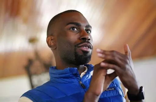 In this March 26, 2016, file photo, Black Lives Matter activist DeRay Mckesson chats with campaign volunteers in Baltimore.  A Louisiana police officer injured when violence broke out over the police killing of a Black man in Baton Rouge in 2016 has grounds to pursue a lawsuit against a protest organizer, Louisiana's Supreme Court said Friday, March 25, 2022. The 6-1 opinion was not a ruling in a case, but an answer to questions posed by a federal appeals court considering whether an officer ide