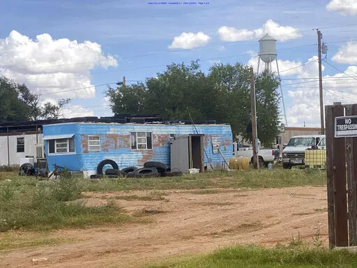 This photo provided by Texas RioGrande Legal Aid shows H-2A farmworker housing in Plains, Texas, in 2021. If employers charge for housing or if it's substandard, federal officials can order them to pay back wages and penalties. Labor advocates are worried that many workers are being cheated. They’re also concerned that investigations by the Labor Department — which has special oversight over guest workers — aren’t keeping pace with a dramatic increase in workers. (Texas RioGrande Legal A
