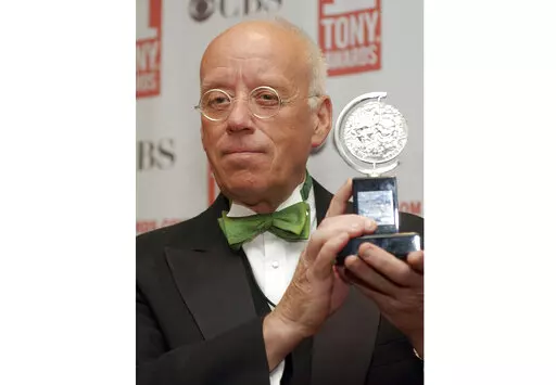 Eugene Lee poses with his Tony Award for Best Scenic Design for "Wicked" at the Tony Awards in New York on June 6, 2004. Lee, the six-time Emmy Award-winning production designer for “Saturday Night Live” and who won three Tony Awards for his Broadway sets, died Tuesday in Providence, R.I. He was 83. (AP Photo/Richard Drew, File)