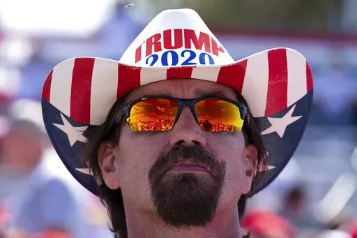 Frank Garner waits for the start of former President Donald Trump's rally in Perry, Ga., on Sept. 25, 2021. (AP Photo/Ben Gray, File)