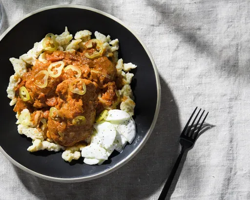This image released by Milk Street shows a recipe for Hungarian chicken paprikash. (Milk Street via AP)