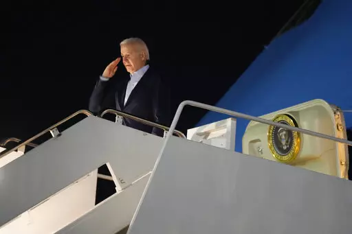 President Joe Biden salutes as he boards Air Force One at Andrews Air Force Base, Md., on Tuesday, Dec. 27, 2022. Biden and his family are traveling to St. Croix, U.S. Virgin Islands, to celebrate New Year. (AP Photo/Manuel Balce Ceneta)