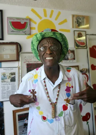 Wally Amos, of Kailua, Hawaii, is shown in his home office on June 12, 2007, in the Lanikai section of Kailua, Hawaii. Amos, the creator of the cookie empire that took his name and made it famous and who went on to become a children’s literacy advocate, has died at age 88, on Tuesday, Aug. 13, 2024. (AP Photo/Lucy Pemoni, File)