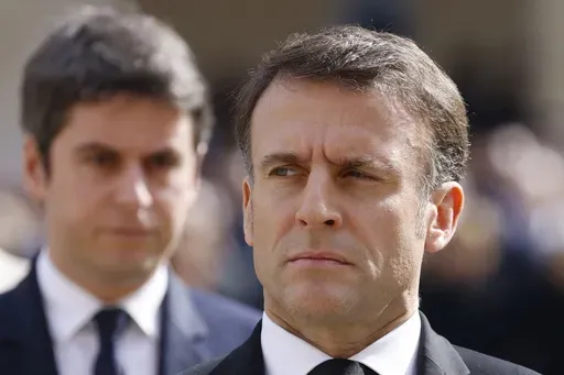 French Prime Minister Gabriel Attal, left, and French President Emmanuel Macron attend a "national tribute" ceremony to late French politician and admiral, Philippe de Gaulle, son of General de Gaulle, in Paris, Wednesday, March 20, 2024. French President Emmanual Macron refused the resignation Monday July 8, 2024 of the country's prime minister, asking him on Monday to remain temporarily as the head of the government after chaotic election results left the government in limbo. ( Ludovic Marin, 