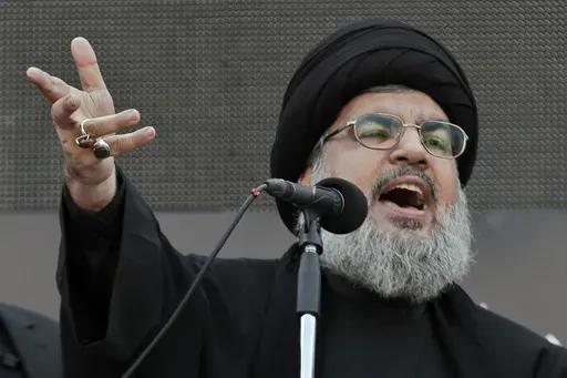 Hezbollah leader Sheik Hassan Nasrallah, speaks to the crowd in a rare public appearance during Ashura, that marks the death of Shiite Islam's Imam Hussein, in the suburbs of Beirut, Nov. 14, 2013. (AP Photo/Bilal Hussein, File)