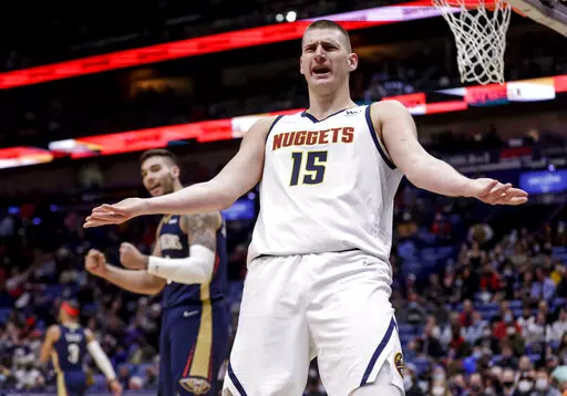 Denver Nuggets center Nikola Jokic (15) reacts to a foul called in the second quarter of an NBA basketball game against the New Orleans Pelicans in New Orleans, Friday, Jan. 28, 2022. (AP Photo/Derick Hingle)